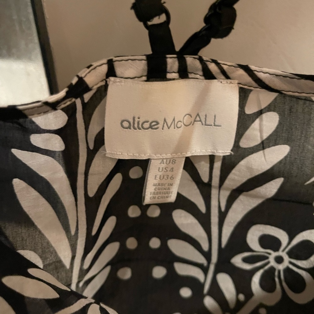 Light cotton material, falls nicely over a pair of jeans